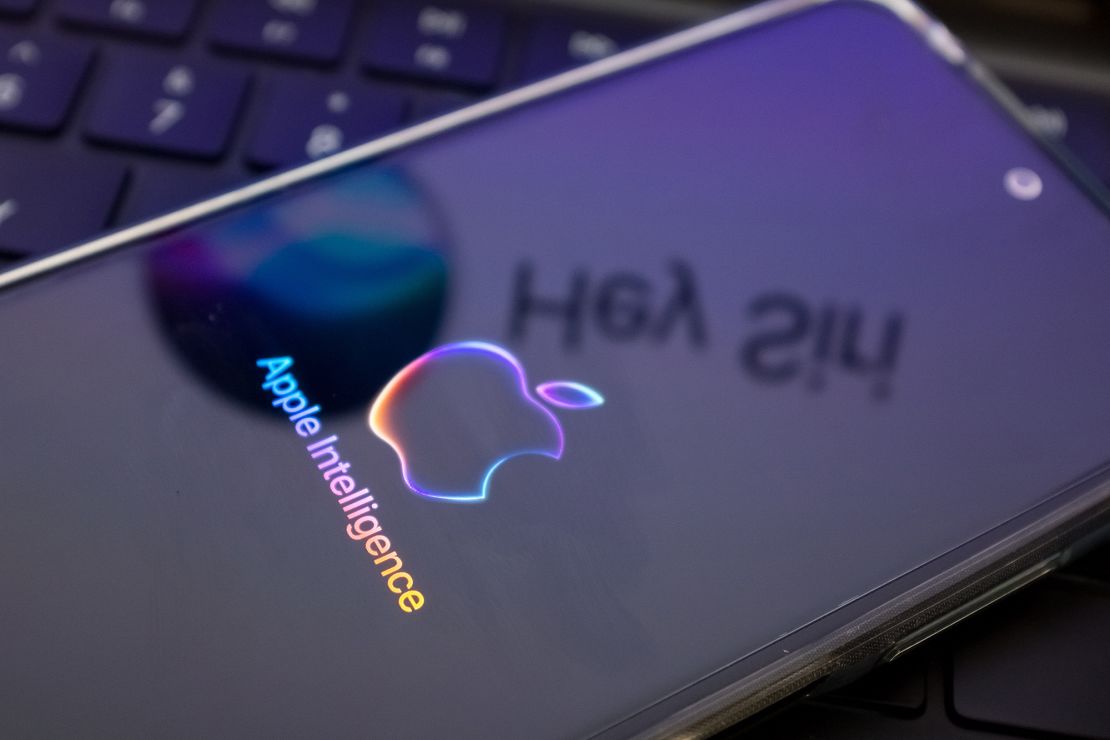 The Apple Intelligence logo is being displayed on a smartphone, with the Apple Siri logo in the background, in this photo illustration in Athens, Greece, on June 12, 2024.