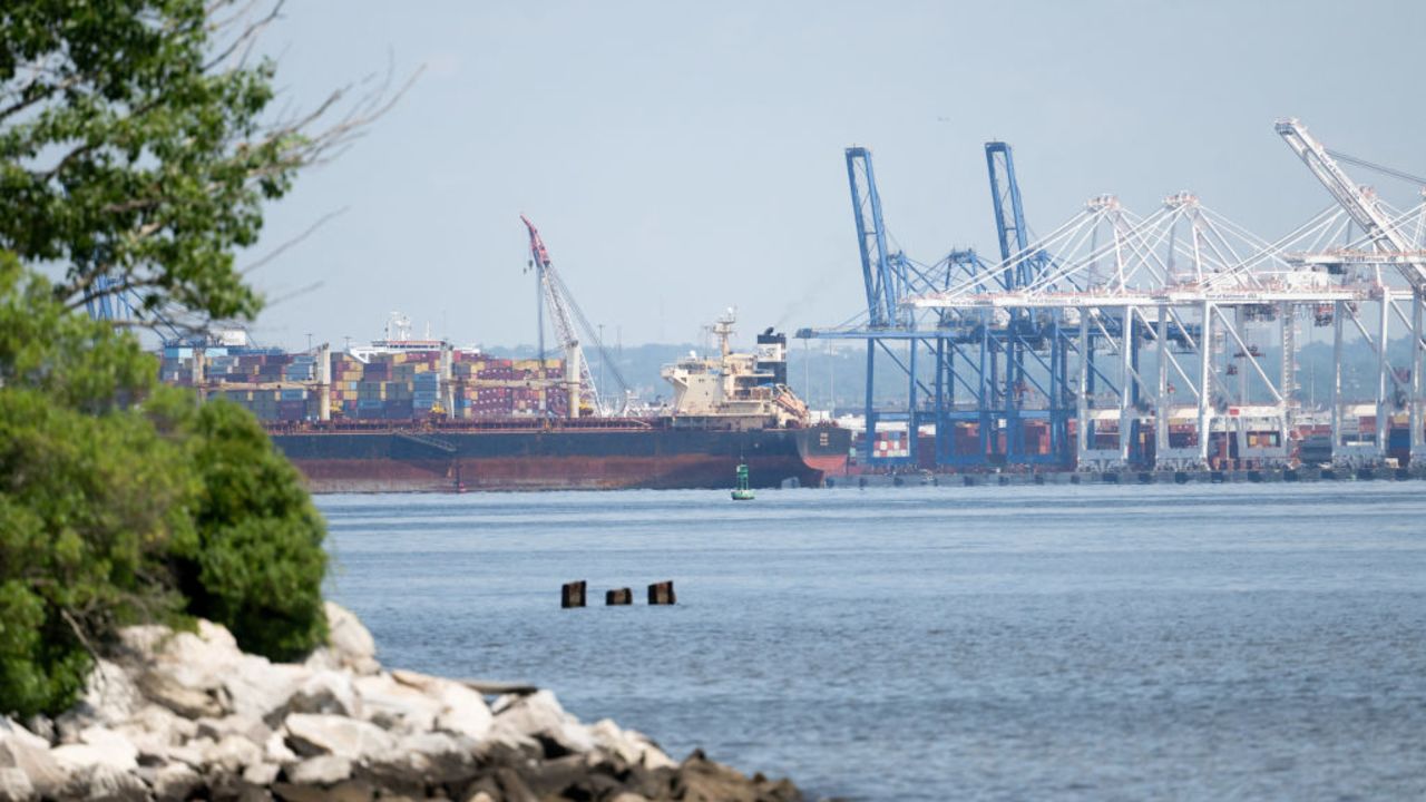 Cargo shipping containers and cranes are seen at cargo terminals as part of the Port of Baltimore in Baltimore, Maryland, June 12, 2024, following the reopening of the shipping channel in the Baltimore Harbor after the Francis Scott Key Bridge collapsed. The lane blocked for more than two months after a cargo ship collided with the bridge in March  reopened on June 11, authorities said. The US Army Corps of Engineers, along with Navy salvage divers, restored the channel to its original dimensions by removing about 50,000 tons of debris, a statement from the Key Bridge Response Unified Command said. (Photo by SAUL LOEB / AFP) (Photo by SAUL LOEB/AFP via Getty Images)