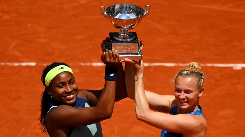 Coco Gauff of United States and Katerina Siniakova of Czechia celebrate with the trophy after victory against Jasmine Paolini of Italy and Sara Errani of Italy in the Women's Doubles Final match on Day 15 of the 2024 French Open at Roland Garros on June 09, 2024 in Paris, France.