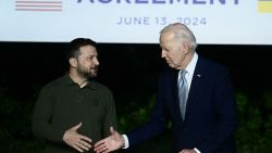 TOPSHOT - Ukrainian President Volodymyr Zelensky (L) and US President Joe Biden shake hands after signing a bilateral security agreement during a press conference at the Masseria San Domenico on the sidelines of the G7 Summit hosted by Italy in Apulia region, on June 13, 2024 in Savelletri. Presidents Joe Biden and Volodymyr Zelensky signed a landmark US-Ukraine security deal on Thursday, as the US leader warned Russia's Vladimir Putin they were "not backing down". (Photo by Filippo MONTEFORTE / AFP) (Photo by FILIPPO MONTEFORTE/AFP via Getty Images)