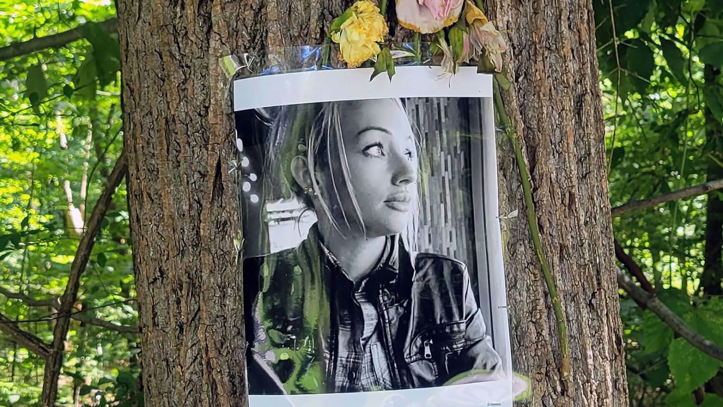 A memorial for Rachel Morin is displayed on a tree on the Ma & Pa Trail in Bel Air, Maryland.