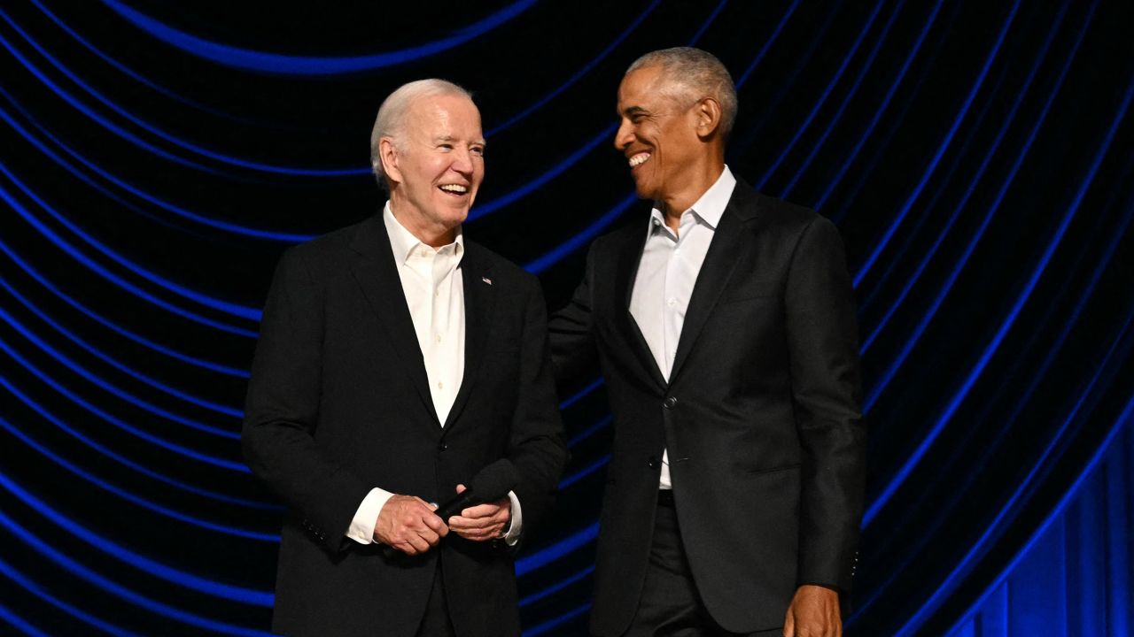 President Joe Biden stands with former President Barack Obama onstage during a campaign fundraiser at the Peacock Theater in Los Angeles on June 15, 2024.