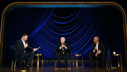 President Joe Biden speaks, flanked by US television host Jimmy Kimmel and former President Barack Obama, onstage during a campaign fundraiser at the Peacock Theater in Los Angeles on June 15, 2024.