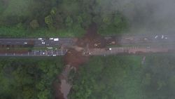 Aerial view of the collapse of a drainage underneath the Palin-Escuintla road due to the heavy rains in Palin, near Guatemala City on June 16, 2024. Six people died and thousands have been affected in El Salvador and Guatemala due to heavy rains that hit Central America since June 15, according to authorities from both countries. (Photo by Jesus MIRANDA / AFP) (Photo by JESUS MIRANDA/AFP via Getty Images)