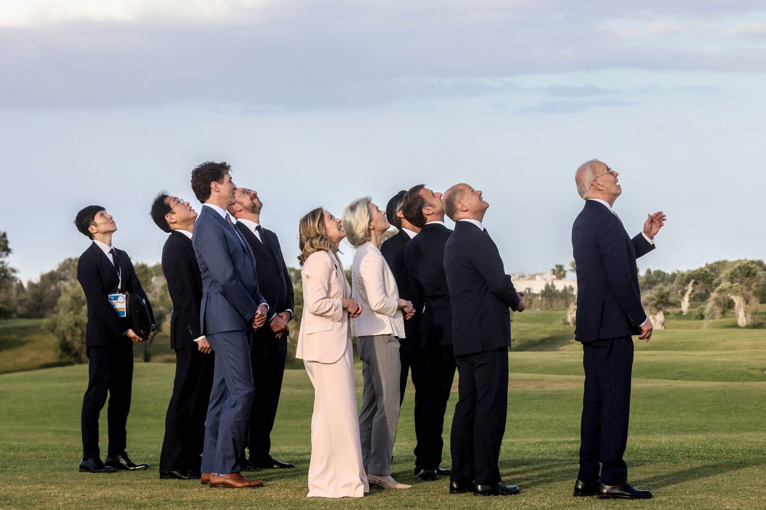 World leaders watch a parachute drop demonstration during the first day of the <a href="https://www.cnn.com/2024/06/13/politics/g-7-leaders-italy/index.html">G7 summit</a> in Bari, Italy, on Thursday, June 13. From right are US President Joe Biden, German Chancellor Olaf Scholz, French President Emmanuel Macron, British Prime Minister Rishi Sunak, European Commission President Ursula von der Leyen, Italian Prime Minister Giorgia Meloni, European Council President Charles Michel, Canadian Prime Minister Justin Trudeau and Japanese Prime Minister Fumio Kishida.