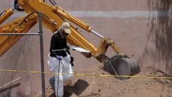 A forensic expert walks next to a clandestine grave in Tlajomulco, Jalisco State, Mexico, on June 17, 2024. At least 10 bodies buried in a clandestine grave in western Mexico have been exhumed since June 14, the leader of a collective searching for the disappeared told AFP. (Photo by ULISES RUIZ / AFP) (Photo by ULISES RUIZ/AFP via Getty Images)