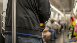A homeless man asks subway passengers for donations June 10, 2024 in New York City. New York City has more 93,000 homeless people.