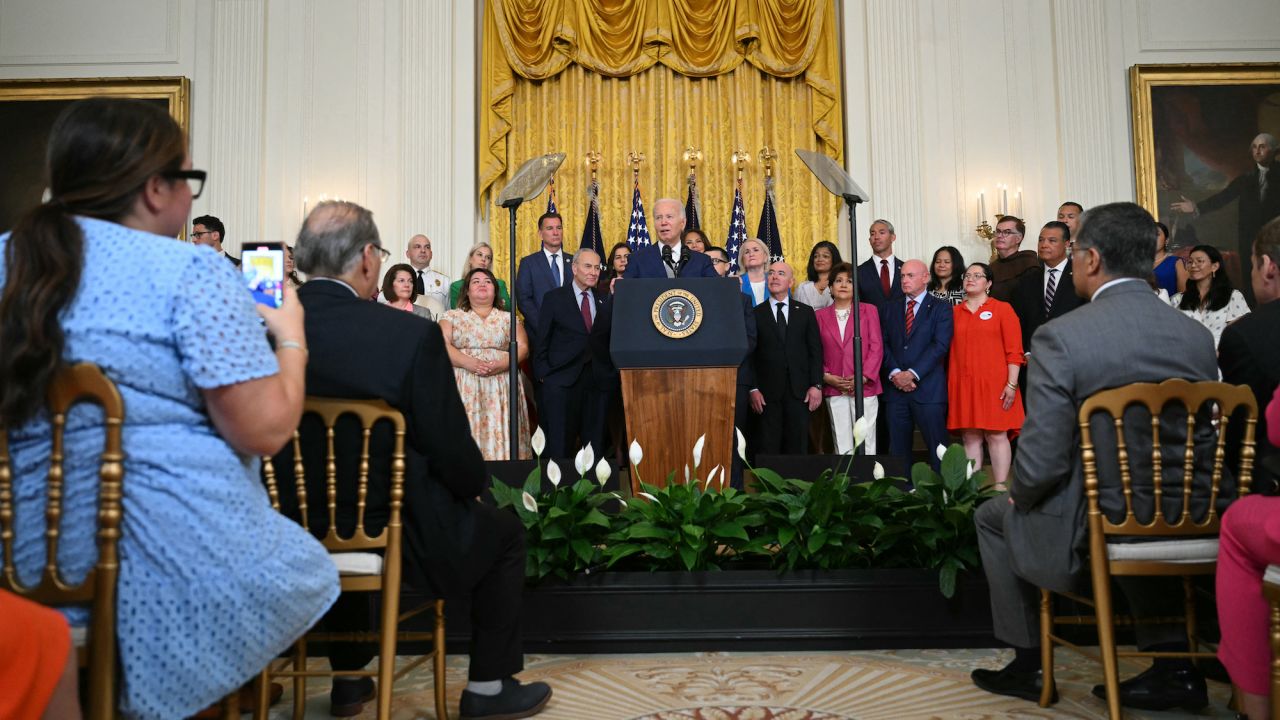 US President Joe Biden speaks at an event marking the 12th anniversary of Deferred Action for Childhood Arrivals (DACA) at the White House in Washington, DC, on June 18, 2024. President Joe Biden announced Tuesday a new potential citizenship path for immigrants married to US nationals, balancing a recent crackdown on illegal border crossers in an attempt to thread a tricky pre-election political needle. (Photo by Drew ANGERER / AFP)
