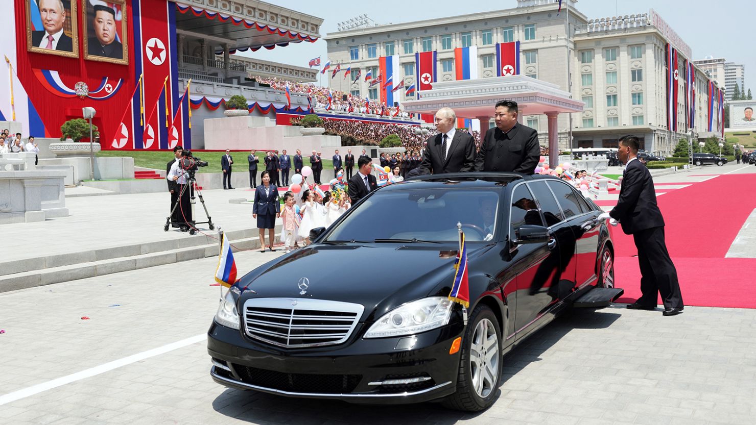 North Korean leader Kim Jong Un and Russian President Vladimir Putin ride a Mercedes-Benz at a welcoming ceremony in Pyongyang on June 19, 2024.