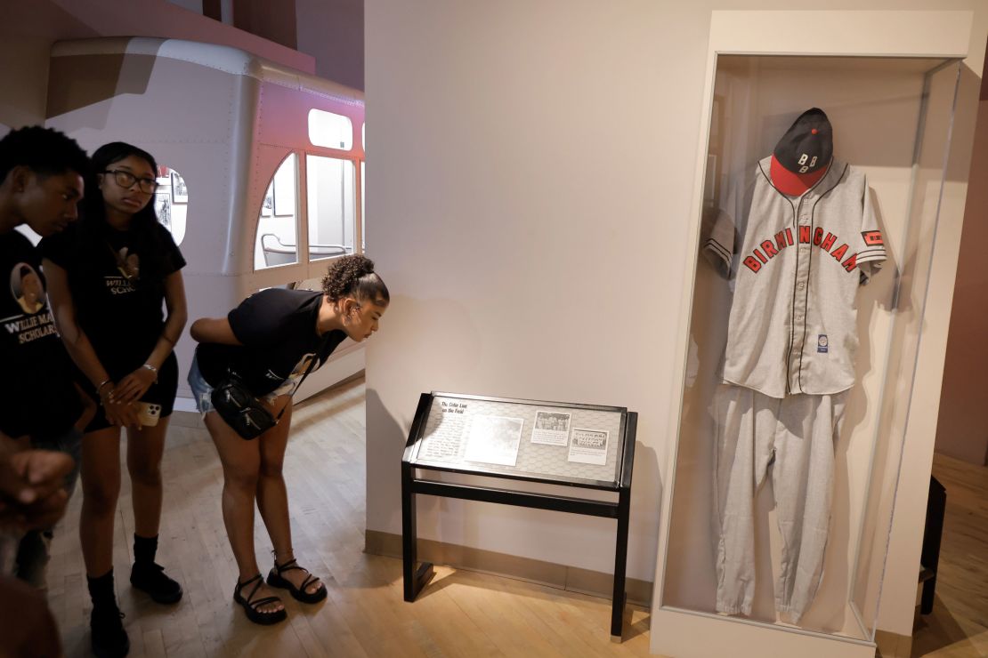 While visiting the Birmingham Civil Rights Institute, a group of Willie Mays Scholars look at a display about the Negro League baseball team, Birmingham Black Barons, in Birmingham, Alabama, on June 18.