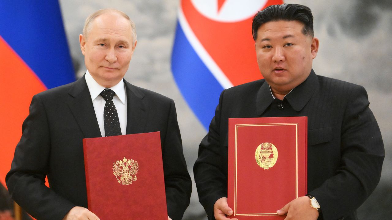 In this pool photograph distributed by the Russian state agency Sputnik, Russian President Vladimir Putin (L) and North Korea's leader Kim Jong Un (R) attend a signing ceremony following their bilateral talks at Kumsusan state residence in Pyongyang, on June 19, 2024.  (Photo by Kristina Kormilitsyna / POOL / AFP) / -- Editor's note : this image is distributed by the Russian state owned agency Sputnik - (Photo by KRISTINA KORMILITSYNA/POOL/AFP via Getty Images)