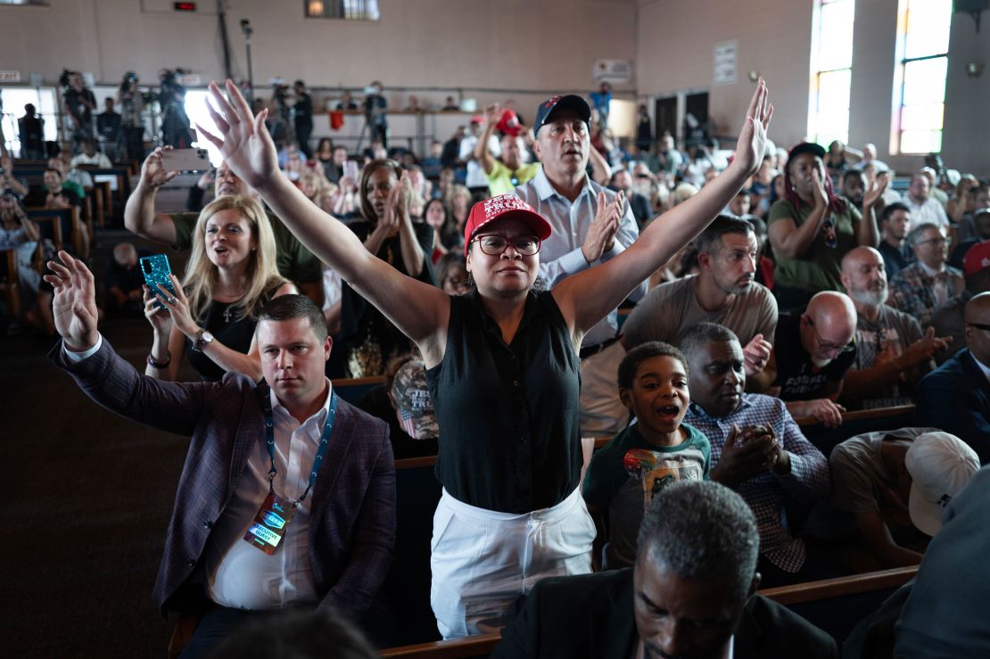 Guests pray at the close of a roundtable discussion with community leaders and former President Donald Trump at the 180 Church in Detroit on June 15, 2024.