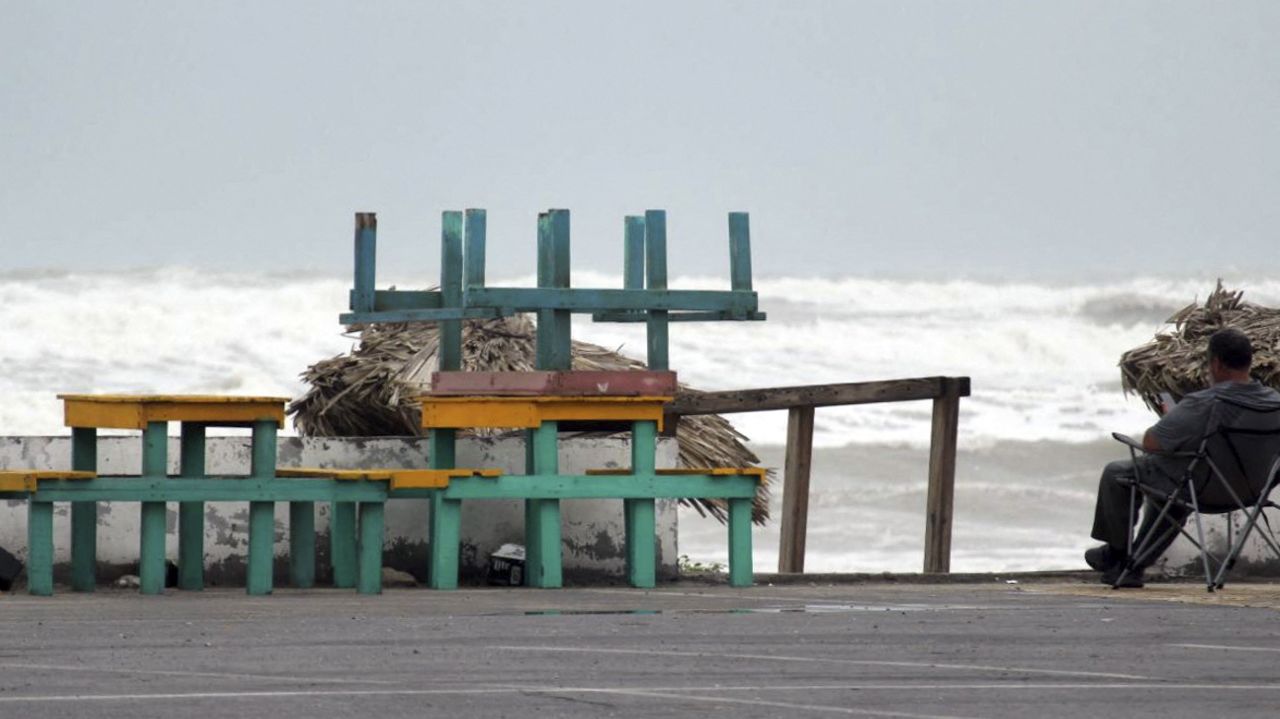 A man looks at the sea on Bagdad Beach before the arrival of Tropical Storm Alberto in Matamoros, State of Tamaulipas, Mexico, on June 19, 2024. (Photo by ABRAHAM PINEDA / AFP) (Photo by ABRAHAM PINEDA/AFP via Getty Images)