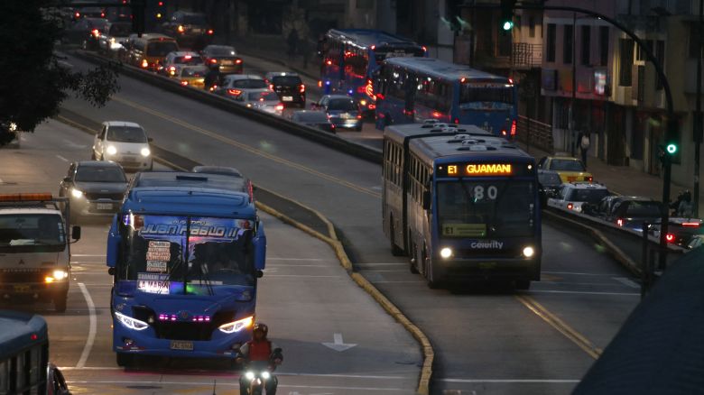 Vehicles travel in near darkness during a blackout in Quito, Ecuador on June 19, 2024.