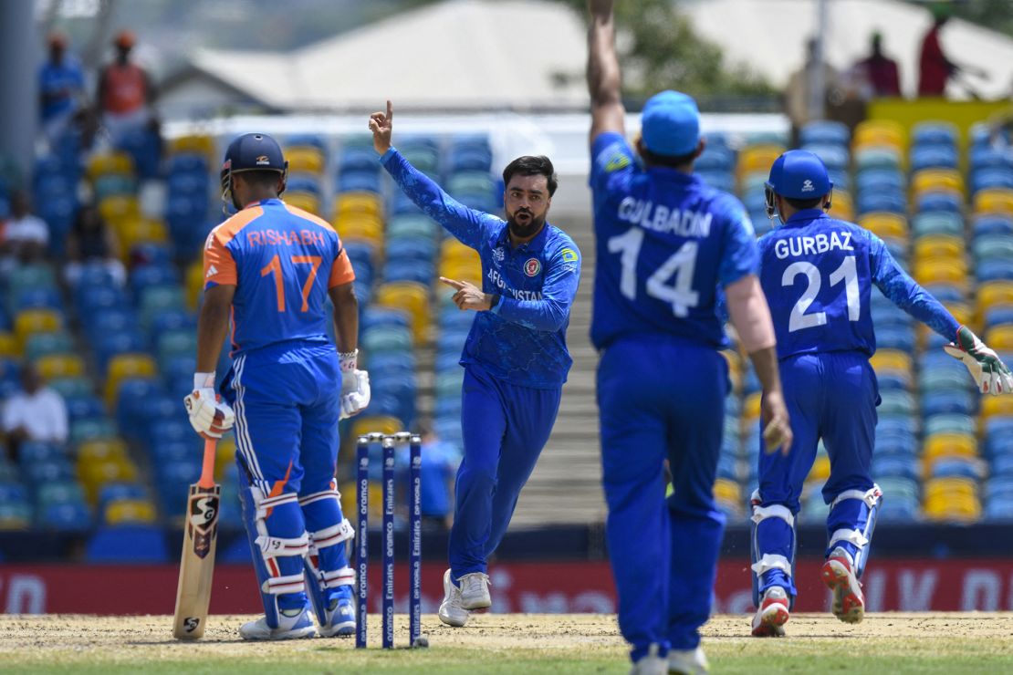 Khan (middle) celebrates the dismissal of India's Rishabh Pant at the T20 World Cup.