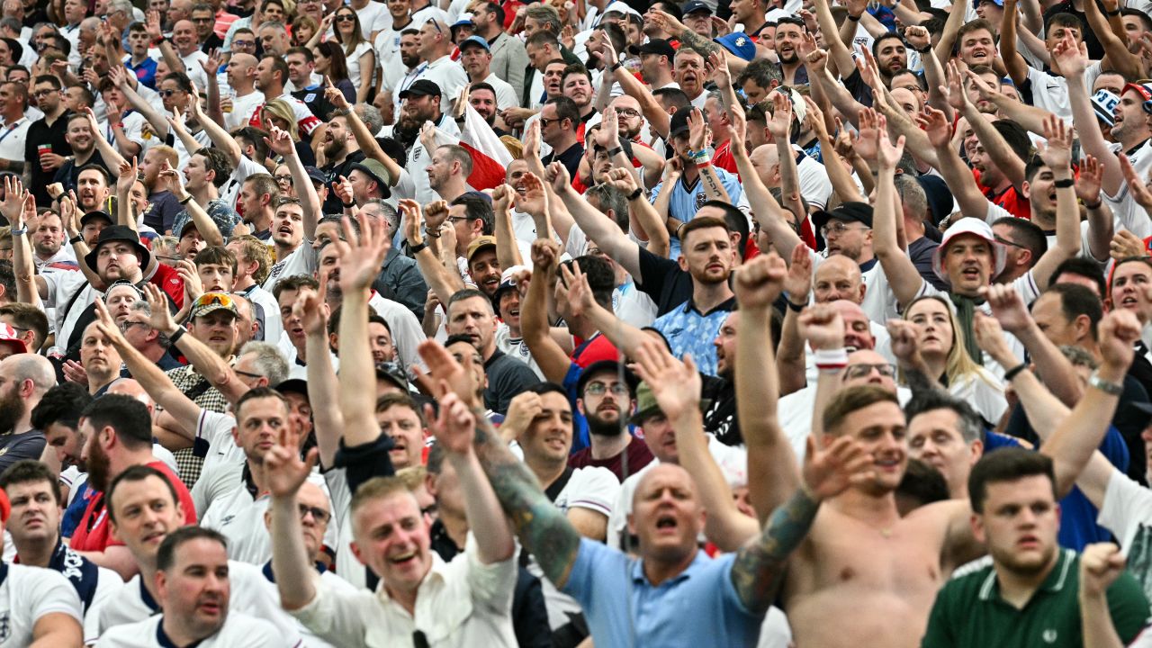 Fans of England cheer on after England opened the scoring during the UEFA Euro 2024 Group C football match between Denmark and England at the Frankfurt Arena in Frankfurt am Main on June 20, 2024. (Photo by JAVIER SORIANO / AFP) (Photo by JAVIER SORIANO/AFP via Getty Images)