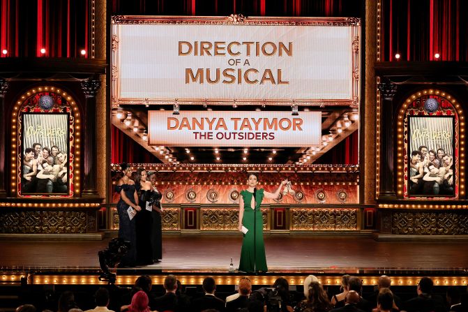 Danya Taymor accepts the best direction of a musical award for "The Outsiders."