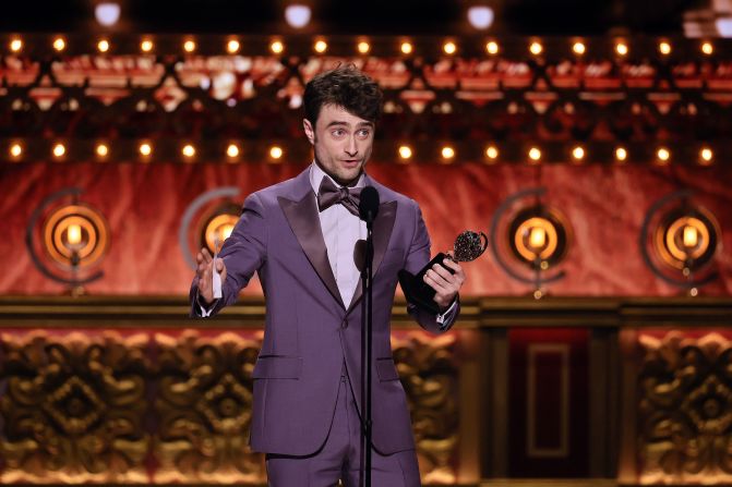 Daniel Radcliffe accepts the award for best performance by an actor in a featured role in a musical for his role in "Merrily We Roll Along."