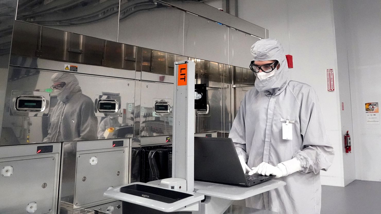 An employee at the GlobalFoundries semiconductor manufacturing facility in Malta, New York, pictured in June 2024.