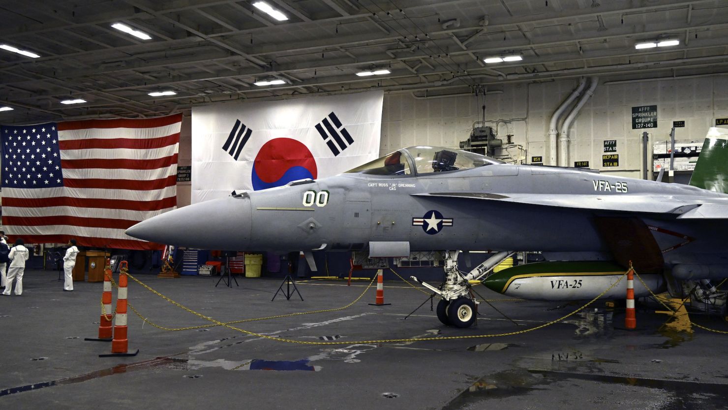 An F/A-18 fighter aircraft sits in the hangar of the USS Theodore Roosevelt anchored in Busan Naval Base in Busan on June 22, 2024.