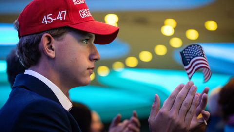 A young Trump supporter applauds as the ex-President and convicted felon speaks at the annual Road to Majority conference in Washington, DC, June 22, 2024.  The conference host, Faith and Freedom Coalition, advocates for incorporation of Christianity in American government. (Photo by Allison Bailey / Middle East Images / Middle East Images via AFP) (Photo by ALLISON BAILEY/Middle East Images/AFP via Getty Images)