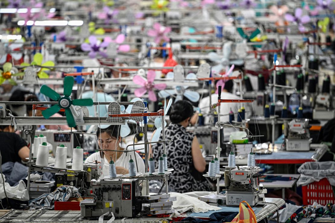 Workers make clothes at a textile factory that supplies clothing to Shein in Guangzhou, in southern China's Guangdong Province, on June 11, 2024.