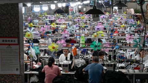 This photo taken on June 11, 2024 shows workers producing garments at a textile factory that supplies clothes to fast fashion e-commerce company Shein in Guangzhou in southern China's Guangdong province.