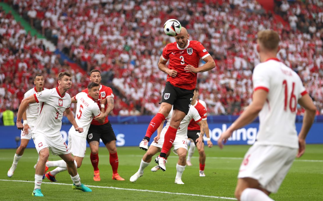 Gernot Trauner of Austria scores his team's first goal against Poland. Julian Finney/Getty Images