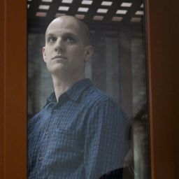 US journalist Evan Gershkovich, accused of espionage, looks out from inside a glass defendants' cage prior to a hearing in Yekaterinburg's Sverdlovsk Regional Court on June 26, 2024. (Photo by NATALIA KOLESNIKOVA / AFP) (Photo by NATALIA KOLESNIKOVA/AFP via Getty Images)
