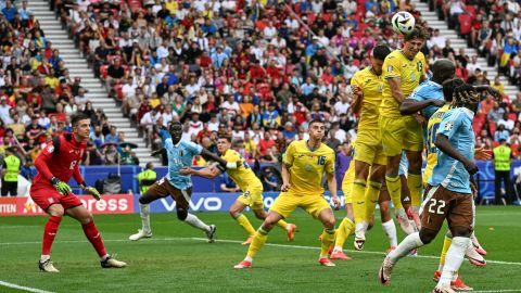 Ukraine's defender #13 Illia Zabarnyi jumps to head the ball during the UEFA Euro 2024 Group E football match between Ukraine and Belgium at the Stuttgart Arena in Stuttgart on June 26, 2024.