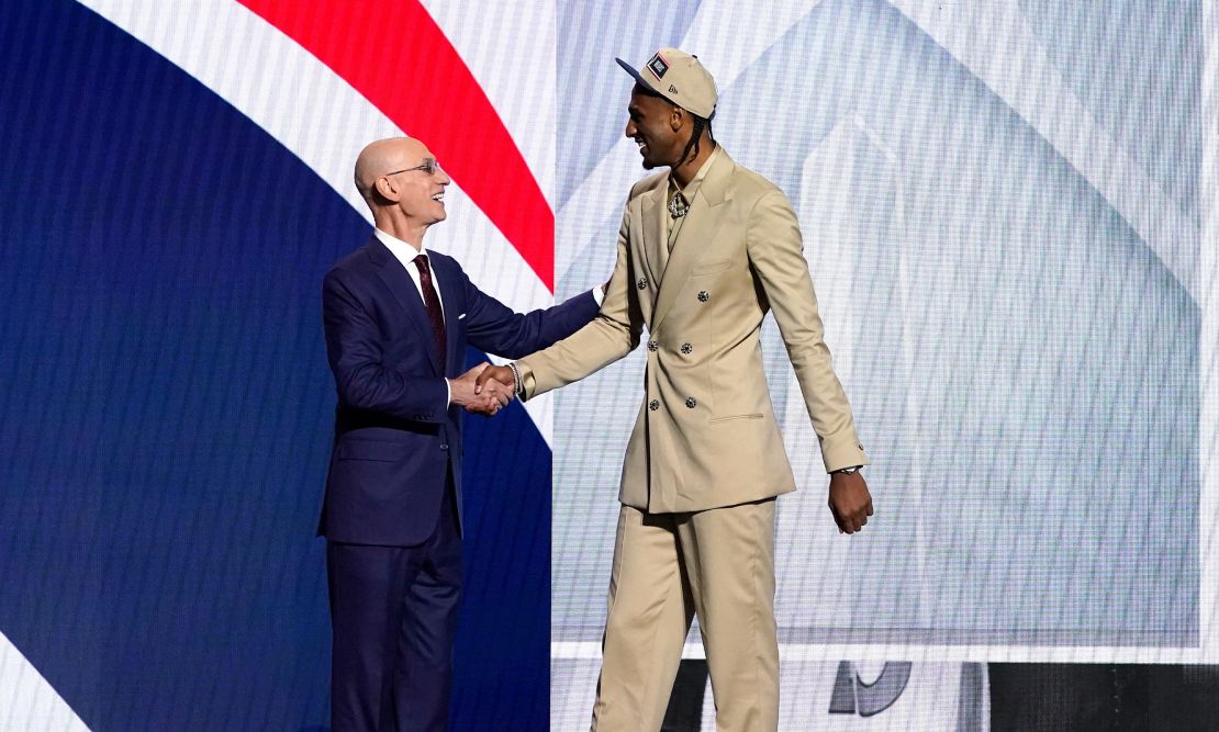 French basketball player Alex Sarr, right, with Silver after being drafted by the Washington Wizards.