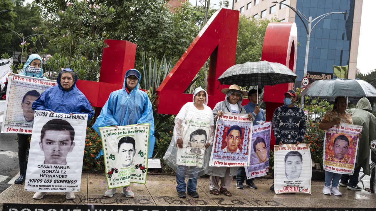 Parents and classmates hold pictures of some of the missing students during a rally demanding the government to clarify the whereabouts of the 43 students of the Ayotzinapa rural teachers' school in the state of Guerrero, in Mexico City on June 26, 2024. (Photo by Yuri CORTEZ / AFP) (Photo by YURI CORTEZ/AFP via Getty Images)