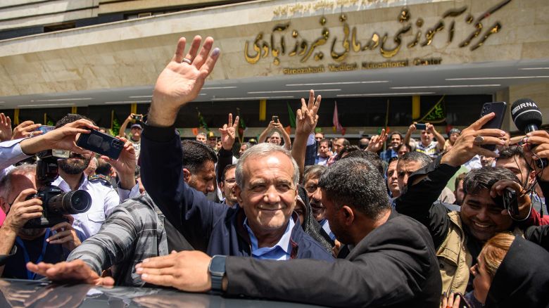 Masoud Pezeshkian, Iranian presidential election candidate and former reformist member of the Iranian parliament waves to the crowd after casting his vote at a polling station in Tehran, Iran on June 28, 2024. Around 61 million Iranians are eligible to vote in the snap presidential election to choose the next president after the death of Ebrahim Raisi in a helicopter crash.