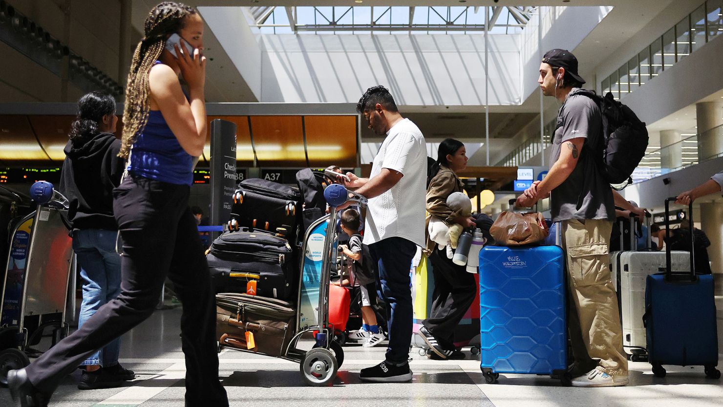 On June 25, 2024, travelers go through Los Angeles International Airport ahead of the official July 4 holiday period. TSA said it screened a record-setting 2.99 million passengers on June 23 and that it had expected to pass the 3 million passenger mark on Friday, June 28. However, the record was not broken as TSA said it screened 2.93 million that day.