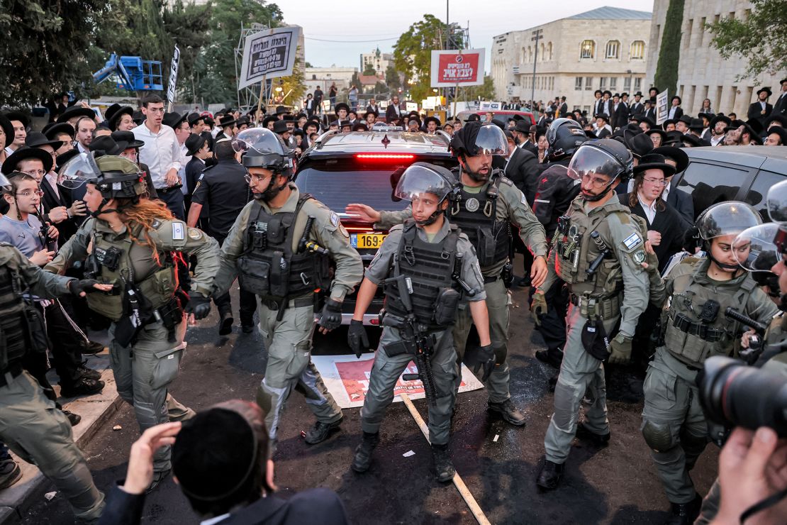 Israeli security forces deploy in Jerusalem's Mea Sharim neighborhood on Saturday ahead of a protest by ultra-Orthodox men.