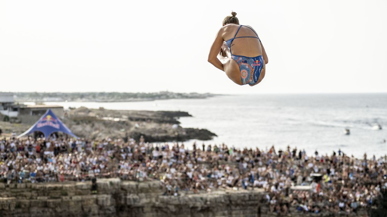 POLIGNANO A MARE, ITALY - JUNE 30: (EDITOR'S NOTE: This handout image was provided by a third-party organization and may not adhere to Getty Images’ editorial policy; EDITORIAL USE ONLY) In this handout image provided by Red Bull, Rhiannan Iffland of Australia dives from the 21.5 metre platform during the final competition day of the third stop of the Red Bull Cliff Diving World Series on June 30, 2024 at Polignano a Mare, Italy. (Photo by Dean Treml/Red Bull via Getty Images)