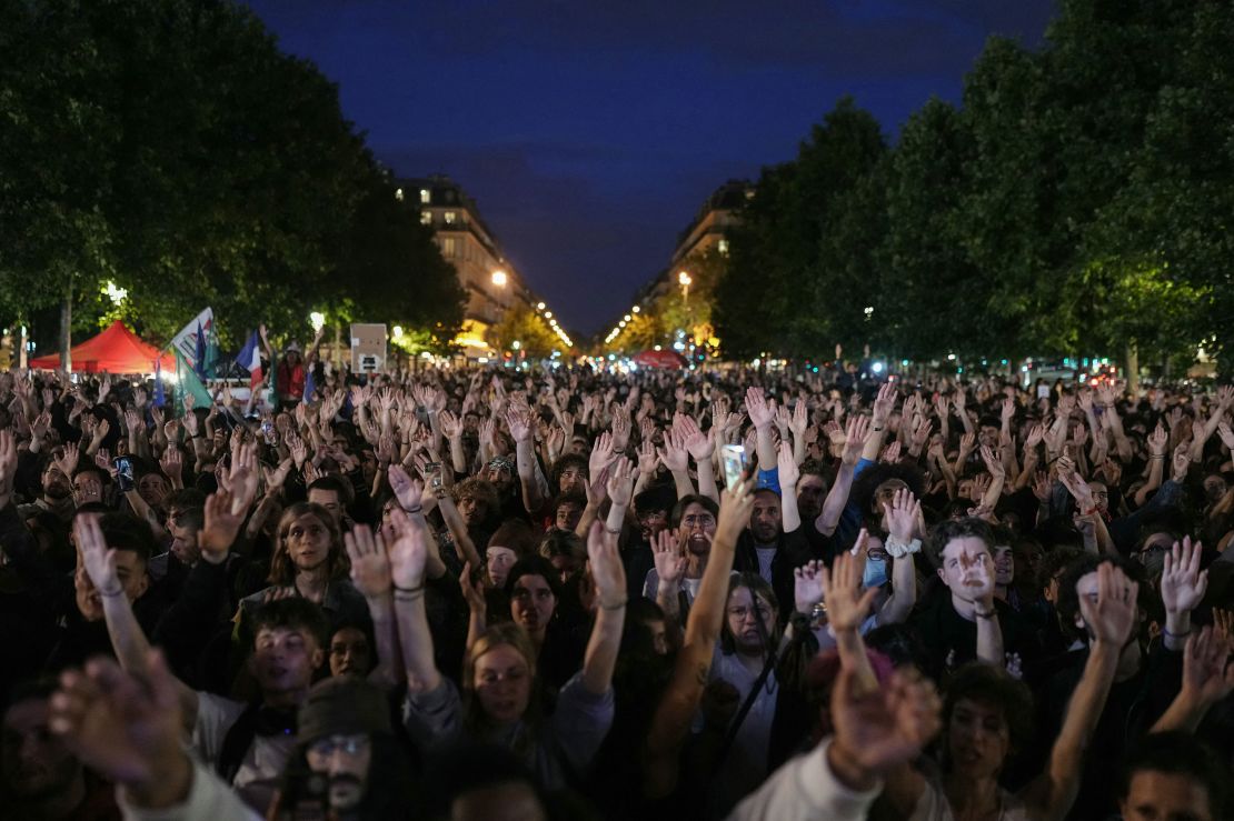 Demonstrators take part in a rally against the far right after the announcement of the results of the first round of parliamentary elections, at Place de la Republique in Paris on June 30, 2024.