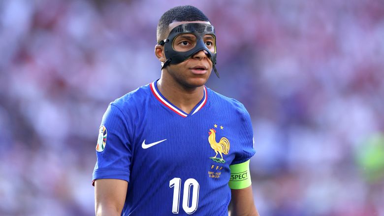 DORTMUND, GERMANY - JUNE 25:  Kylian Mbappe of France looks on, whilst wearing a Black Protective Face Mask after breaking his nose in the Group D fixture against Austria, during the UEFA EURO 2024 group stage match between France and Poland at Football Stadium Dortmund on June 25, 2024 in Dortmund, Germany. (Photo by Dean Mouhtaropoulos/Getty Images)