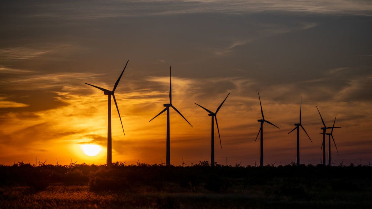 NOLAN, TEXAS - JUNE 28: Wind turbines in a field at sunrise on June 28, 2024 in Nolan, Texas. (Photo by Brandon Bell/Getty Images)