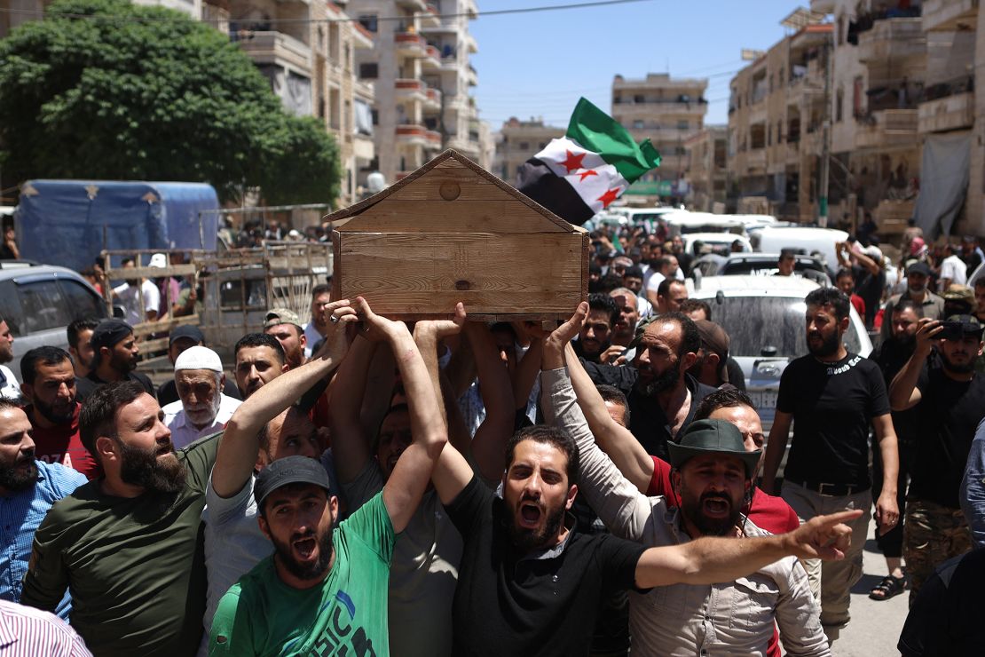 Syrians attend the funeral procession of a man killed during clashes with Turkish troops, in Afrin in northern Syria on July 2.