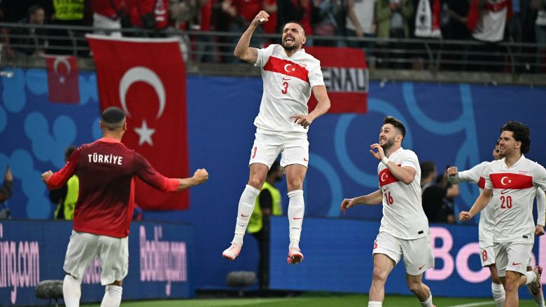 Turkey's defender #03 Merih Demiral (C) celebrates after scoring the opening goal during the UEFA Euro 2024 round of 16 football match between Austria and Turkey at the Leipzig Stadium in Leipzig on July 2, 2024. (Photo by JAVIER SORIANO / AFP) (Photo by JAVIER SORIANO/AFP via Getty Images)