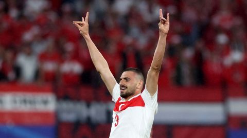 Turkey's defender #03 Merih Demiral makes a controversial hand gesture as he celebrates scoring his team's second goal during the UEFA Euro 2024 round of 16 football match between Austria and Turkey at the Leipzig Stadium in Leipzig on July 2, 2024. UEFA said on July 3, 2024 it had opened a probe into Turkey defender Merih Demiral for celebrating a goal in the team's 2-1 win against Austria at Euro 2024 with an allegedly ultra-nationalist salute. The tournament organiser said in a statement it was investigating the player for "inappropriate behaviour" during the knockout game in Leipzig. The gesture, which Demiral made to the crowd after scoring his second goal of the game, is associated with Turkish ultra-nationalist group Grey Wolves.