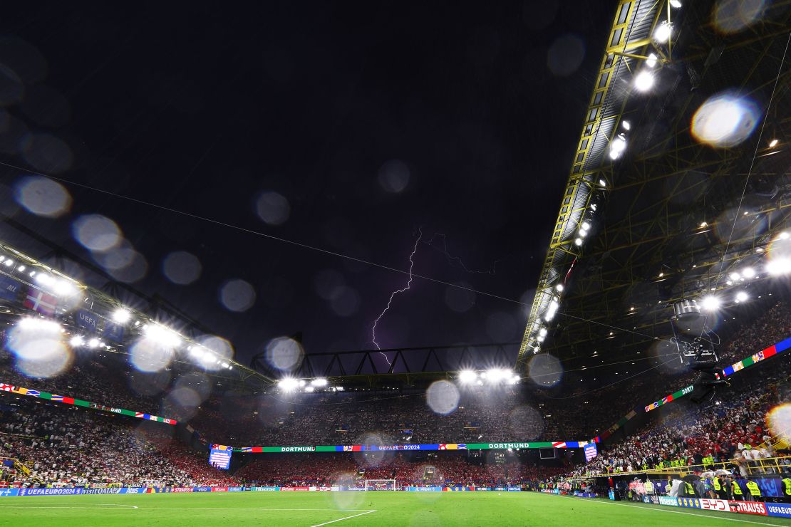 Lightning is seen inside the stadium during the enforced break. Alexander Hassenstein/Getty Images