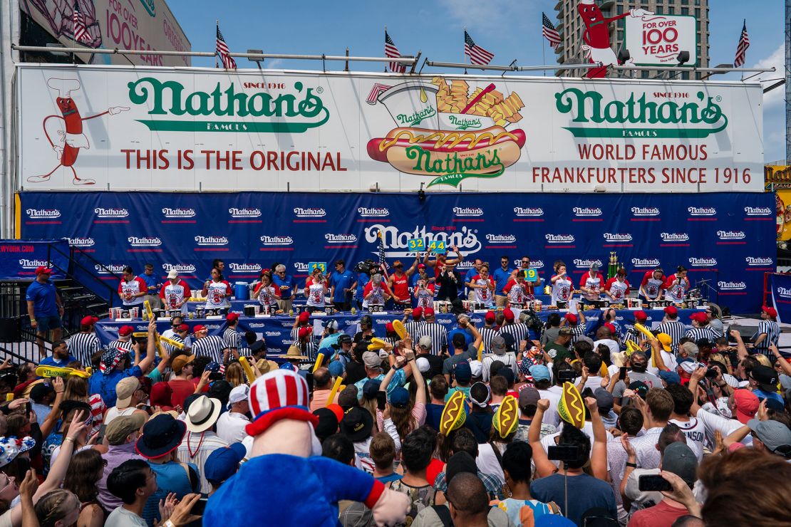 Competitors compete for the women's title at Nathan's Annual Hot Dog Eating Contest on July 4, 2024.