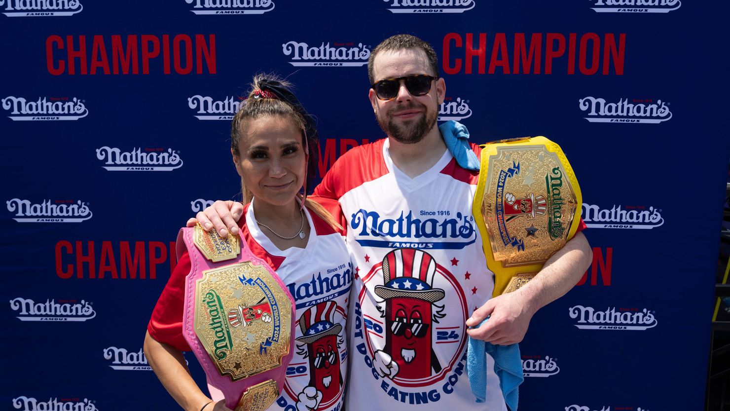 Winners Patrick Bertoletti and Miki Sudo pose for a photograph after Nathan's Famous International Hot Dog Eating Contest on July 4 in New York City.