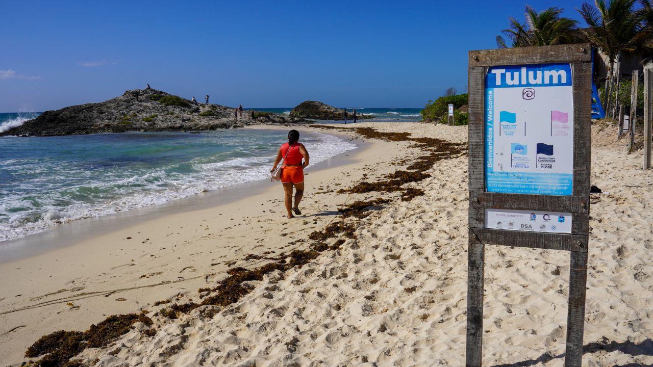 A woman walks along the shore of the beach before Hurricane Beryl's arrival in Tulum, Quintana Roo State, Mexico, on July 4, 2024. Tourist resorts in Mexico's Yucatan Peninsula girded Thursday for a hit from Hurricane Beryl, which is still packing ferocious winds after slamming Jamaica and the Cayman Islands. (Photo by Elizabeth Ruiz / AFP) (Photo by ELIZABETH RUIZ/AFP via Getty Images)