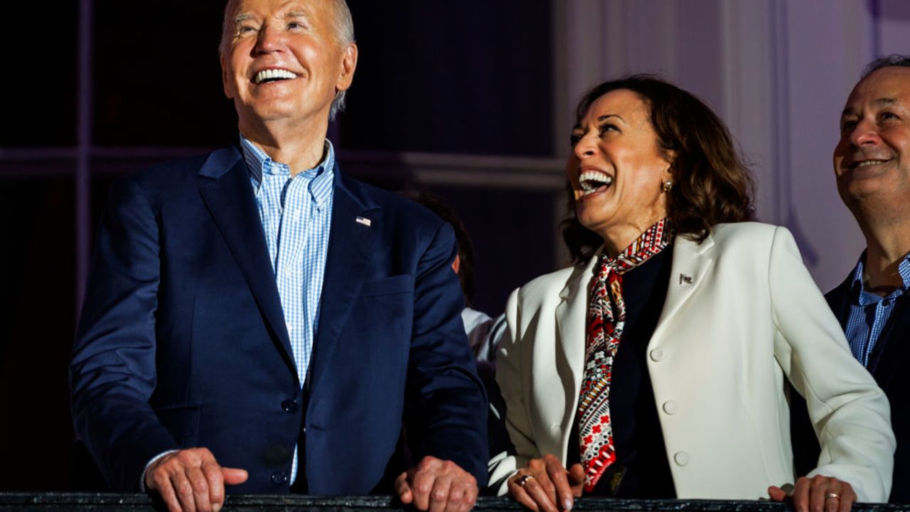 WASHINGTON, DC - JULY 04: President Joe Biden and Vice President Kamala Harris laugh as they view the fireworks on the National Mall from the White House balcony during a 4th of July event on the South Lawn of the White House on July 4, 2024 in Washington, DC. The President is hosting the Independence Day event for members of the military and their families. (Photo by Samuel Corum/Getty Images)