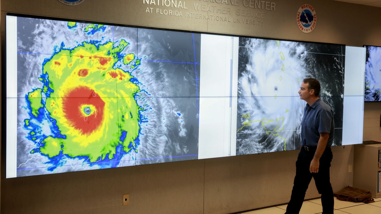 MIAMI, FLORIDA - JULY 01: John Cangialosi, Senior Hurricane Specialist at the National Hurricane Center, inspects a satellite image of Hurricane Beryl, the first hurricane of the 2024 season, at the National Hurricane Center on July 01, 2024 in Miami, Florida. On Monday afternoon, the storm, centered 30 miles west-northwest of Carriacou Island, became the strongest hurricane this early in the season in this area of the Atlantic. (Photo by Joe Raedle/Getty Images)