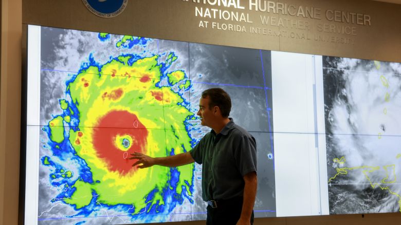 MIAMI, FLORIDA - JULY 01: John Cangialosi, Senior Hurricane Specialist at the National Hurricane Center, inspects a satellite image of Hurricane Beryl, the first hurricane of the 2024 season, at the National Hurricane Center on July 01, 2024 in Miami, Florida. On Monday afternoon, the storm, centered 30 miles west-northwest of Carriacou Island, became the strongest hurricane this early in the season in this area of the Atlantic. (Photo by Joe Raedle/Getty Images)