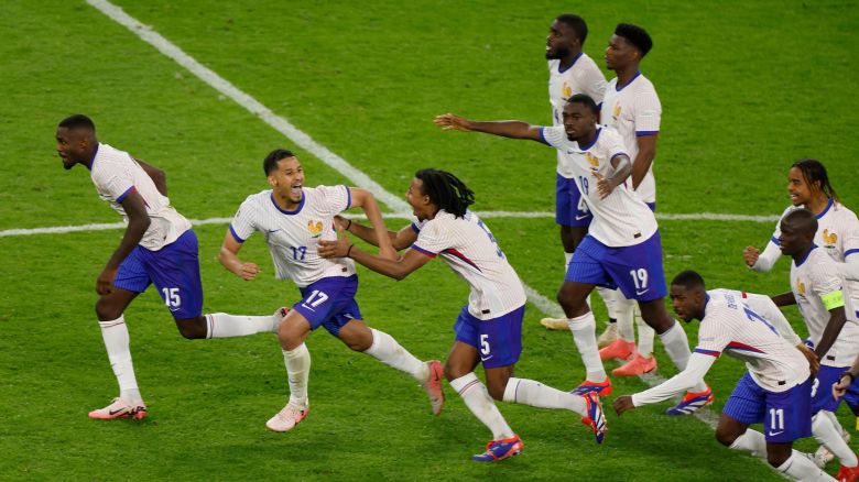 France's players celebrate after beating Portugal at Euro 2024.